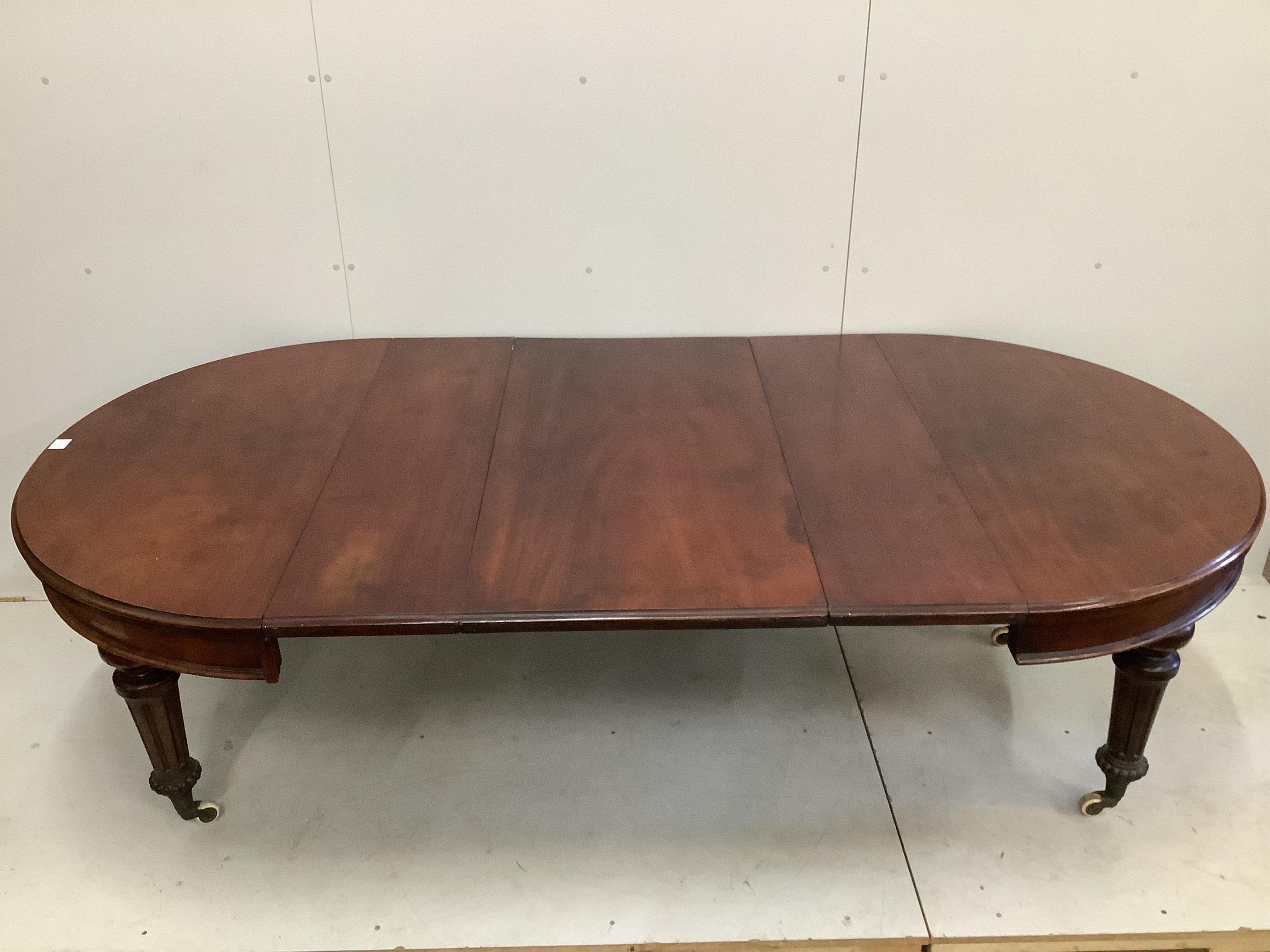 A late Victorian mahogany extending dining table, 240cm extended, three spare leaves, depth 120cm, height 73cm